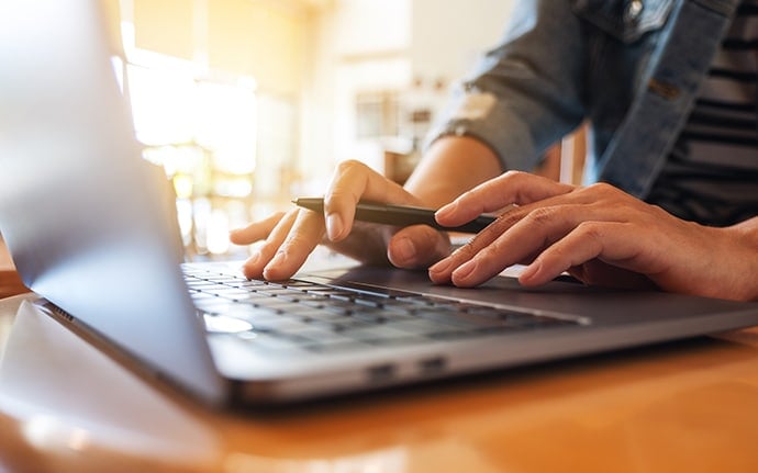 Person Working On Laptop